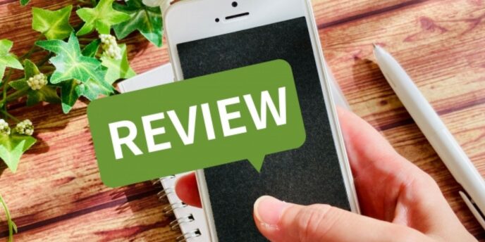 スマートフォンと「REVIEW」の吹き出しが重なった口コミ評価のビジュアル