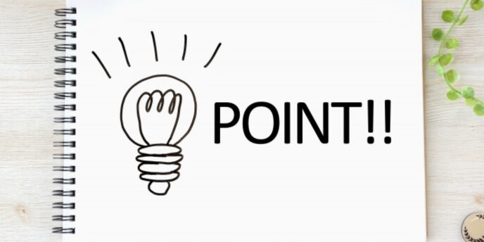 電球のイラストと「POINT!!」の文字が描かれたノートと観葉植物の画像